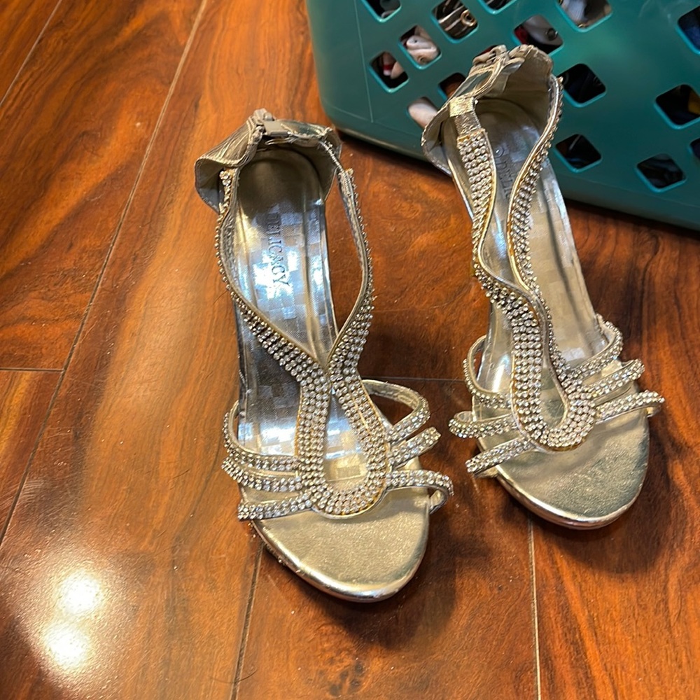 Silver 7.5 delicacy shoes. Worn a handful of time but still have life.